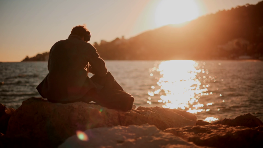 Person sitting quietly feeling mentally restless and thoughtful